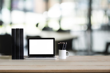 Laptop computer mockup with wood desk.