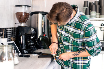 Male Barista preparing coffee