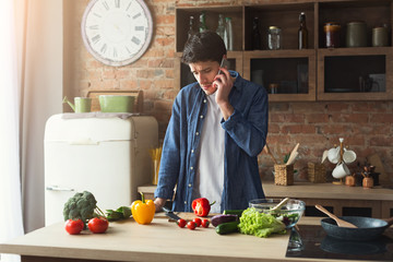 Upset man preparing healthy food in the home kitchen