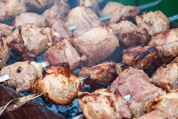 Grilling the marinated pork meat delicious shashlik