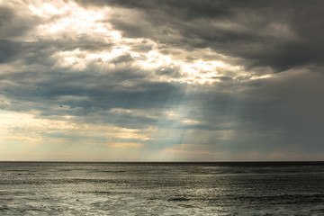 Fototapeta na wymiar Light Rays Over the Ocean at Sunset 