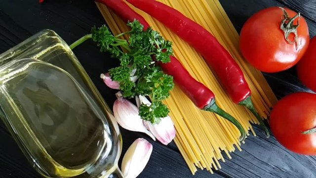 spaghetti, cheese, red pepper, garlic slow-motion shot