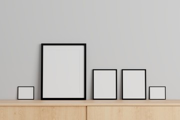 Blank three picture frame for insert text or image inside on the wall in living room.