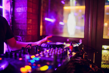 Obraz na płótnie Canvas DJ playing music mixer closeup