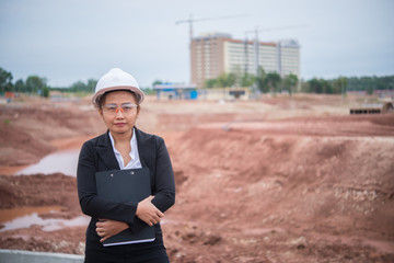 Engineer woman working at site of bridge under construction