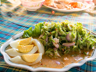 Wing Bean Shrimp Spicy Salad on the table with nature sun light.