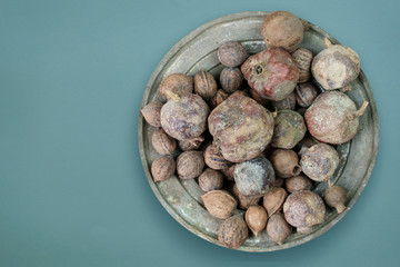 pomegranates and walnutes in the cup