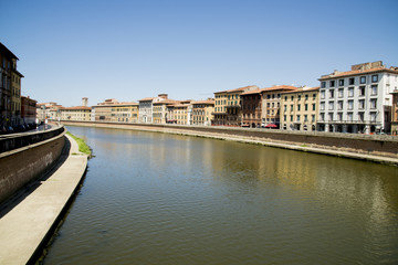 Fototapeta na wymiar Historical buildings along the river Arno in Pisa
