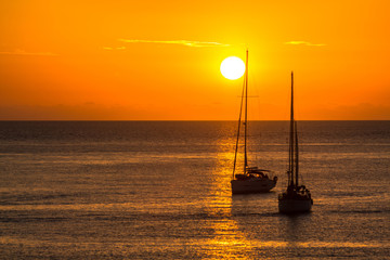Sailboats at sunset