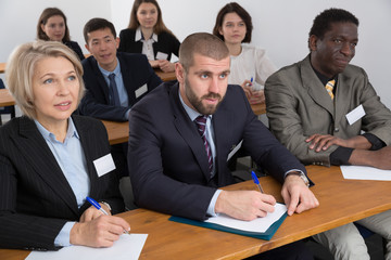 Fototapeta premium People during business seminar in lecture hall
