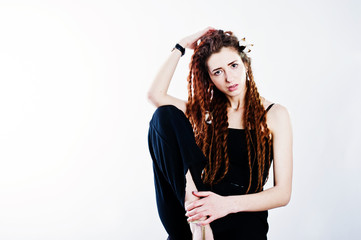 Naklejka premium Studio shoot of girl in black with dreads on white background.