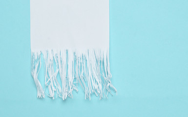 Shredded paper strips on a blue pastel background. Minimalist trend. Top view..