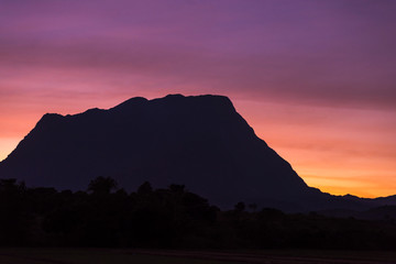 Black silhouette, high mountains, sunset