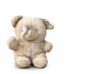 Teddy bear is dirty and lacking.