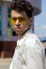 Fototapeta premium Portrait of a man in yellow sunglasses