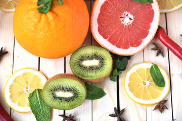 Close-up of juicy grapefruit with fruit on a wooden table. Art soft focus and toned.