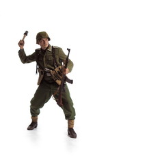 Man actor in the movie role of an old military man  with a MG 42 machine gun posing against white...