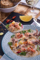 Seafood soup with octopus and prawns.