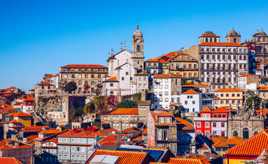 Obraz premium Panoramic view of Old city of Porto (Oporto) and Ribeira over Douro river, Portugal. Concept of world travel, sightseeing and tourism.