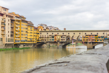 Fototapeta na wymiar Beautiful panoramic view of the Arno River and the town of Renaissance. Firenze. Florence. Italy