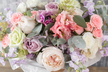 Close-up Beautiful Bouquet. Spring flowers on gray background. flower shop