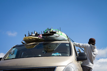 Surfboards mounted on the roof of the car. photo travel. Leisure