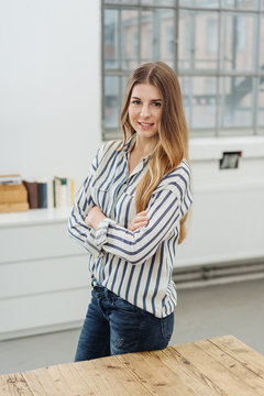 Portrait of young cheerful woman in office
