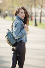 Fototapeta premium Portrait of fashionable woman with dreadlocks keep bag