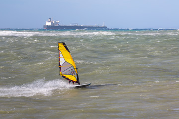 Sea Waves and Wind Surfing in the Summer in Windy Day