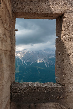 Fototapeta Cloudy Sky and Mountains View from a Window in Italian Dolomites Alps