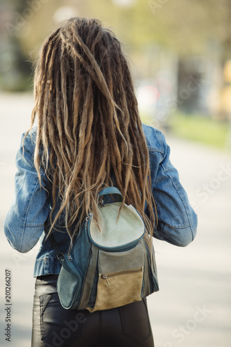 Bag On Woman Back Girl With Dreadlocks Hairstyle