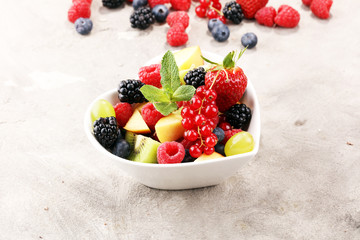 salad with fresh fruits and berries. healthy spring fruit salad