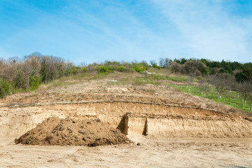 Fototapeta premium Excavation site preparation of terrain for construction of houses in the countryside.