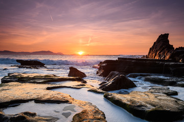 amazing sunset landscape at rocky beach