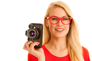 Woman in red with a retro camera isolated over white background