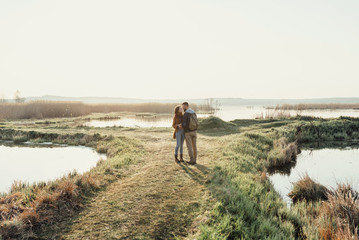 Young tourist couple at sunset sun