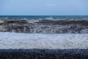 Stormy sea waves breaking near the coast