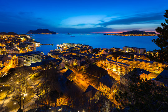 Beautiful Alesund port town at night in Norway