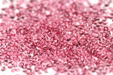 Many scattered rhinestones. On a white background