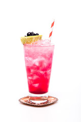 juicy cocktail with currant and lime at glass on white background