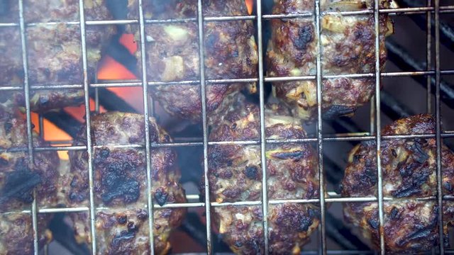 Closeup overhead shot of cooking kofta with camera moving around.