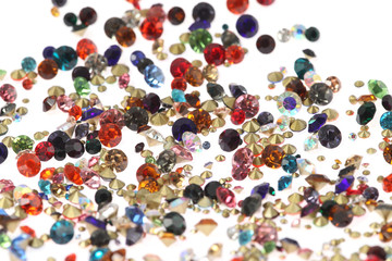 Many scattered rhinestones. On a white background