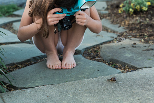 Girl shooting snail