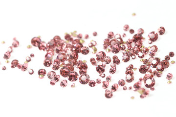 Many scattered rhinestones. On a white background