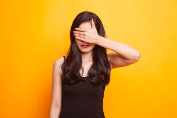 Fototapeta premium Young Asian woman close her mouth with hand.