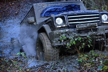 Reduced gear concept. Dirty offroad car rides with obstacles © Volodymyr