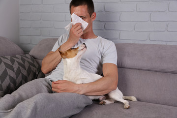 Man having pet allergy symptoms : runny nose, asthma