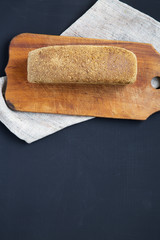 Bread on dark background. From above. Top view. Copy space.