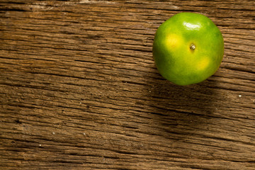 tangerine. sweet orange. on wooden. texture wooden