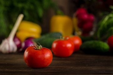 Fresh vegetables on a dark wooden background